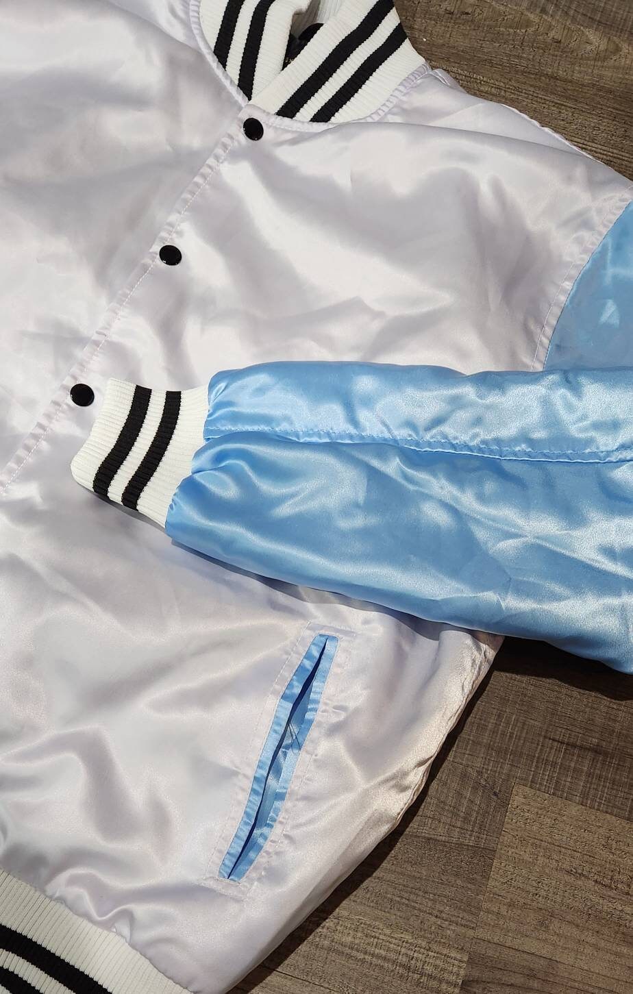 Limited Edition: Satin, Carolina Blue Arms, White Body, Blk Stripes, Varsity Jacket with Ribbed Cuffs, Interior Zipper, Starter Sport Jacket