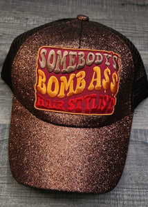 Cute Messy Bun/Ponytail Hat, with "Somebody's Bomb A** HAIRSTYLIST" Color Patch, Glitter Hat, Sparkling Bad Hair Day Hat, Popular Patch